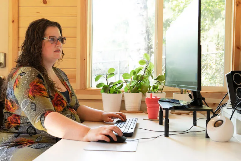 Megan Justice, accountant, working on computer in office